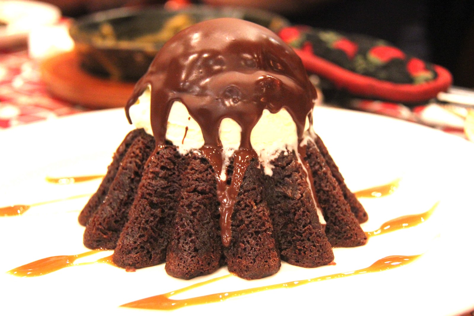 Wooden Spoons & Muffin Tops Devouring A Chocolate Volcano
