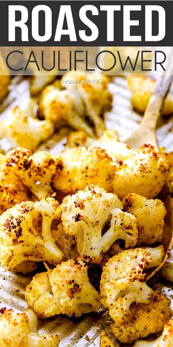 the BEST Roasted Cauliflower I've ever made !  It is bursting with flavor, caramelized edges and the quickest side dish to every meal all made in one pan!  #cauliflower #roastedcauliflower #vegetables #roastedvegetables #curry via @carlsbadcraving