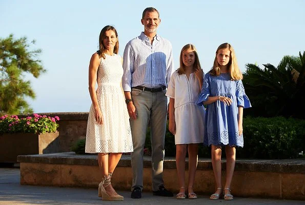Queen Letizia wore a new white cotton dress from Dafalia collection of Hugo Boss. Princess Leonor and Infanta Sofia on holiday