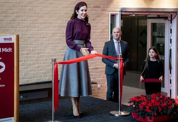 Crown Princess Mary attended the opening of Viborg Regional Hospital's new emergency center. burgundy blouse, grey midi dkirt, grey wool coat