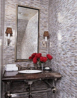You can give a luxurious touch to your small bathroom and make it look larger by incorporating a mirror