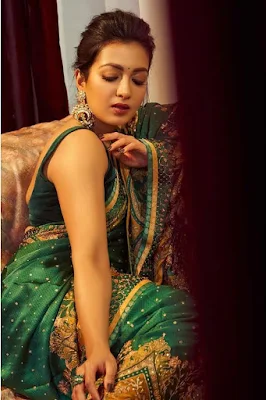 Actress Catherine Tresa Alexander in green saree Photoshoot