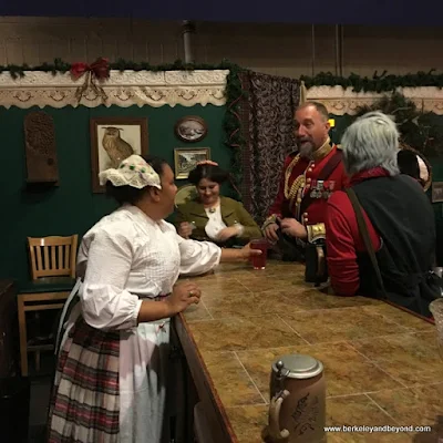 characters belly up to the bar at The Great Dickens Christmas Fair in San Francisco