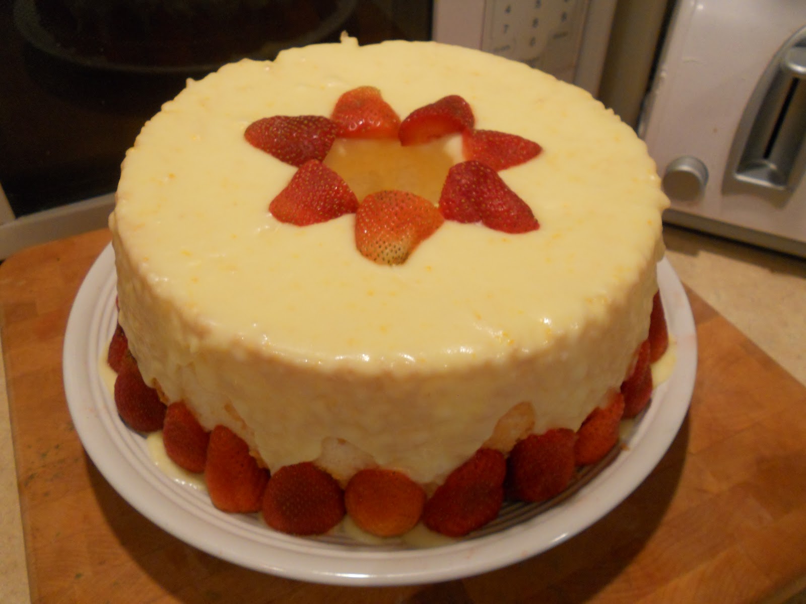 Sweet Emily Angel Food Cake With An Orange Glaze with Fresh Strawberries