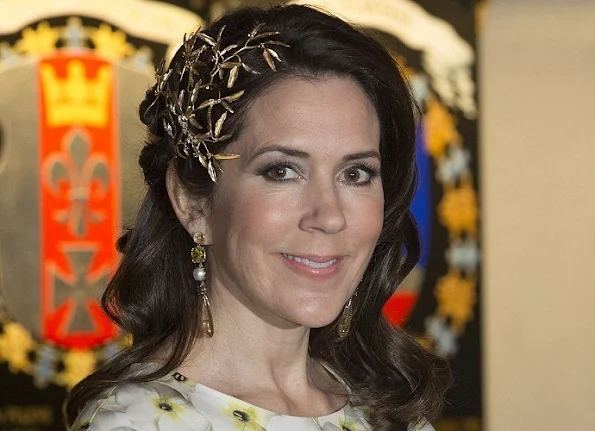 Crown Princess Mary wore a modern headpiece from 'Petit Frost' collection of Ole Lynggaard and Gianvito Rossi pumps, a Yves Saint Laurent clutch bag