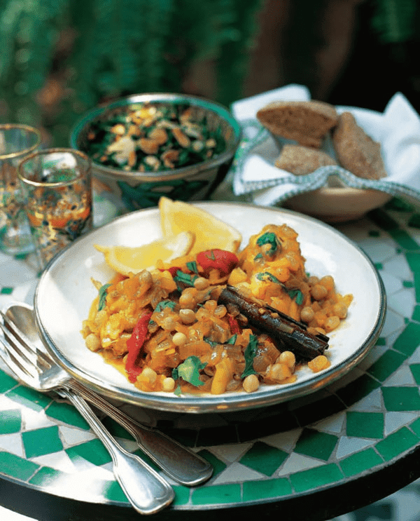 Chicken k’dra with chickpeas, raisins and red peppers