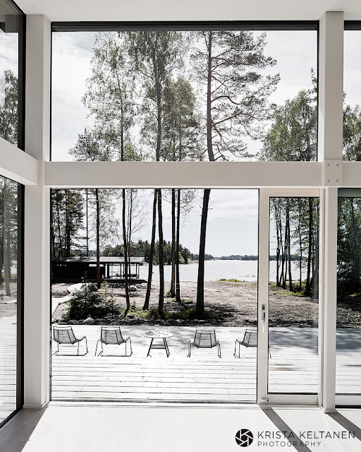 A modern glass walled house in Finland by Krista Keltanen Photography