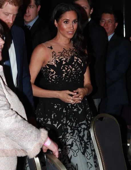 Meghan Markle wore Oscar de la Renta white tulle gown, tweed laser cut birds, from Pre-Fall 2018 collection. Aquazzura Deneuve pumps