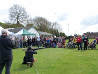 The crowd looks on as I throw a currant bun at the first-ever Abingdon World Bun Throwing Championship back in 2012