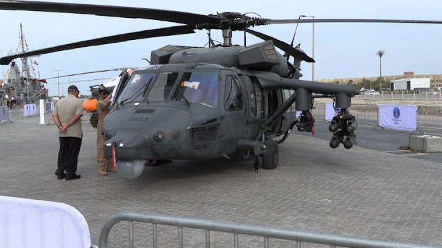 Image Attribute: UAE's newly modified UH-60M with the weaponized kit from AMMROC at IDEX 2019