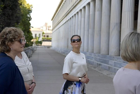 Crown Princess is wearing pleated printed silk midi skirt, and silk shirt half sleeve top at Ancient Agora Museum