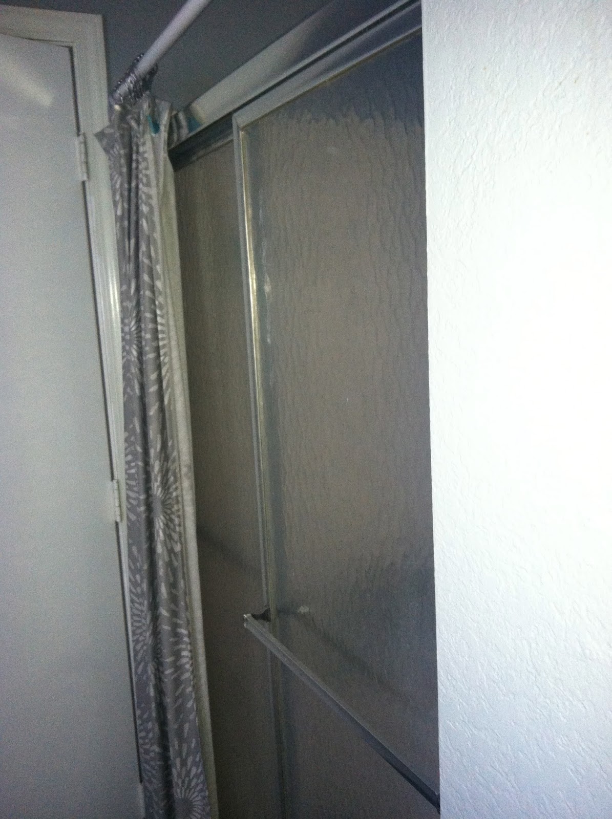 KELL PLACE taking off a sliding shower door