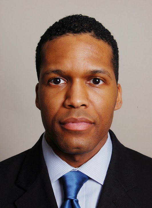headshot of a black actor in washington dc wearing a suit and tie