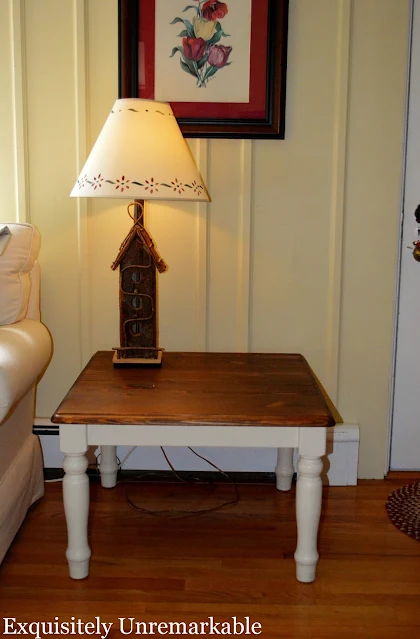 Old Ikea Wooden table with a birdhouse lamp on it