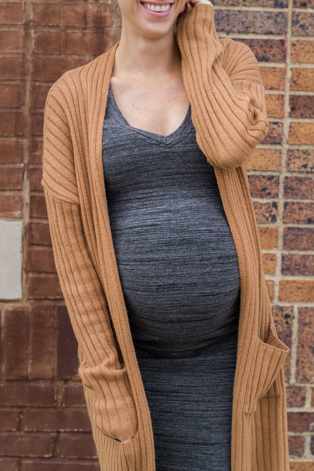 Maternity style in body con dress and oversized cardigan