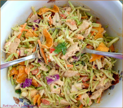 Spicy Broccoli Slaw and Chicken Salad, for lunch or for dinner on a hot summer night. Mix just a few ingredients together, refrigerate, let everyone choose their favorite toppings when you're ready to serve. | Recipe developed by www.BakingInATornado.com | #recipe #salad #chicken