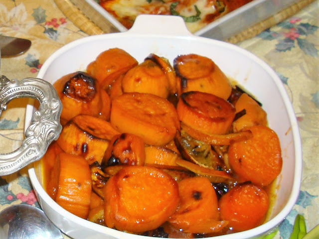 INGREDIENTS  4 large sweet potatoes, peeled and sliced in rounds  ¾ cups maple syrup  2 tsp. brown sugar  2 cinnamon sticks  I orange juice  5 tbsp. butter  1 orange with skin cut in half moons    METHOD  In a pot melt the butter and mix with maple, brown sugar, cinnamon sticks, orange juice and the sliced orange.  Place the sweet potatoes in a baking dish and mix with the syrup.  Bake in the oven at 375° F for about 50 minutes. Once in a while with a spoon pour some of the liquid on top of the potatoes. Brown a bit the potatoes.