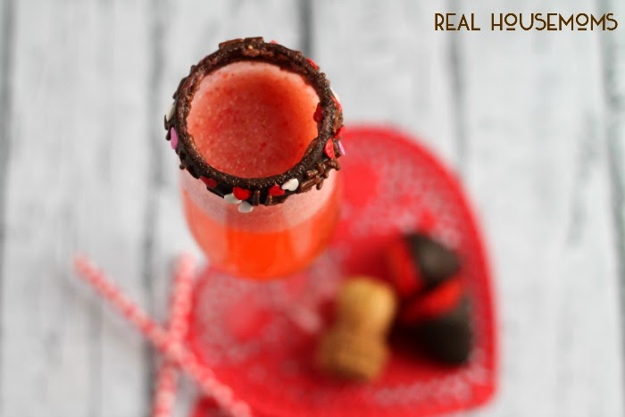 Made with fresh pureed strawberries & your favorite chocolate liquor, and then topped with champagne a chocolate rimmed champagne glass, you just can't go wrong with this Chocolate Covered Strawberry Bellini for Valentine's Day