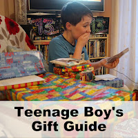 What to Buy a Teenage Boy Gift Guide Boy looking thrilled with a pile of birthday gifts