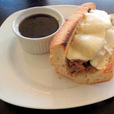 Slow Cooker Roast Beef Sandwiches:  Beef roast slow cooked in broth and beer until tender then placed on a baguette and topped with melted cheese.  The cooking liquid can be used as a dipping sauce.