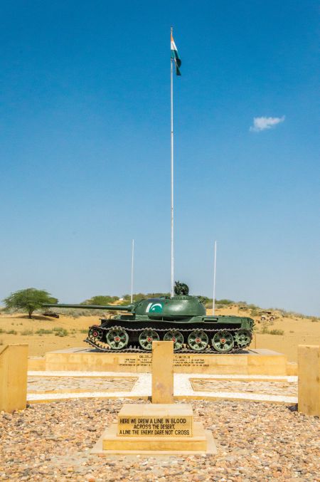 Indian Flag flying high with a a captured Pakistani tank kept beneath it. Indian Flag flying high with a a captured Pakistani tank kept beneath it.