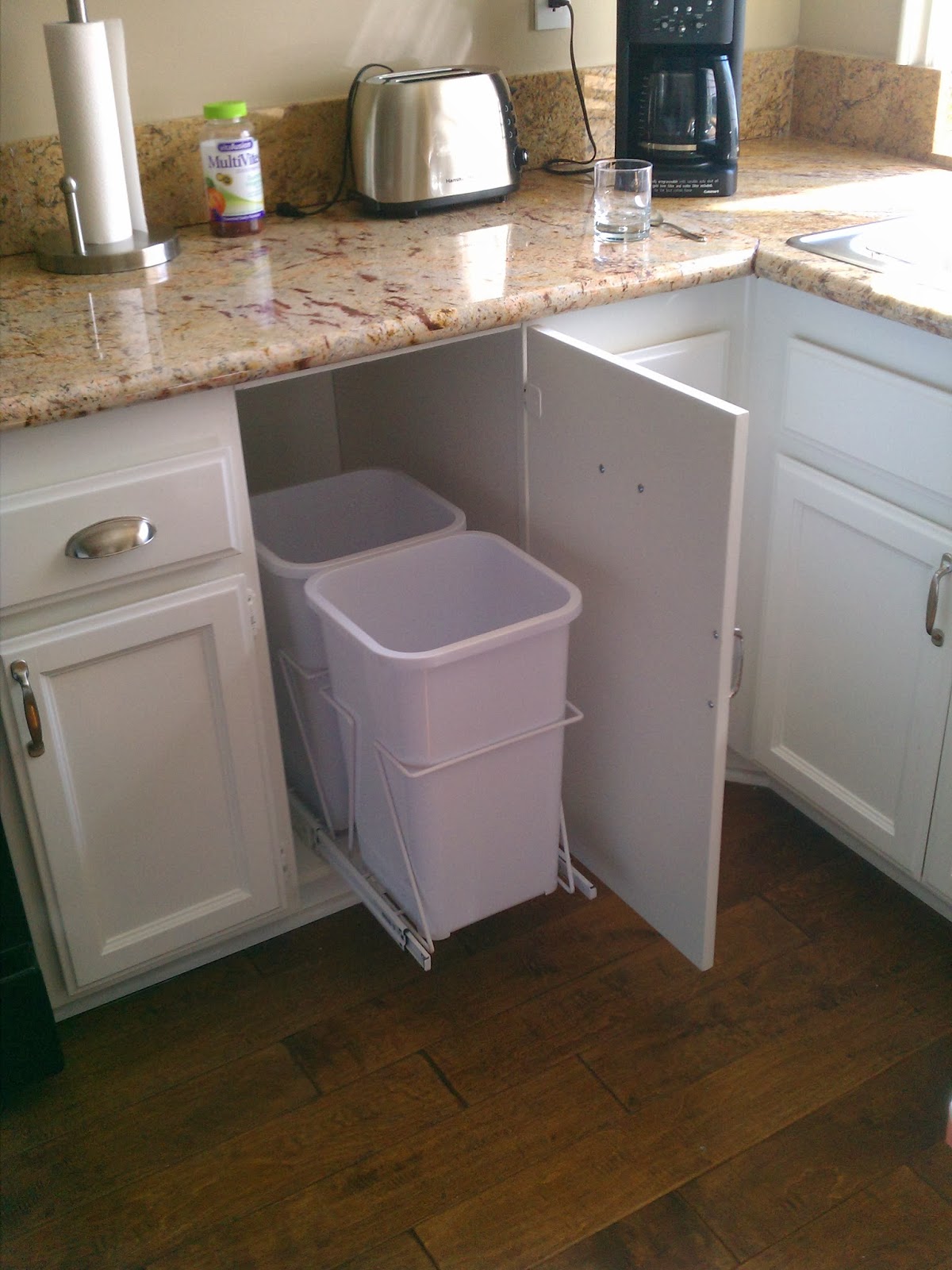 Clark Builders & Restoration Remove garbage compactor Insert garbage cans.