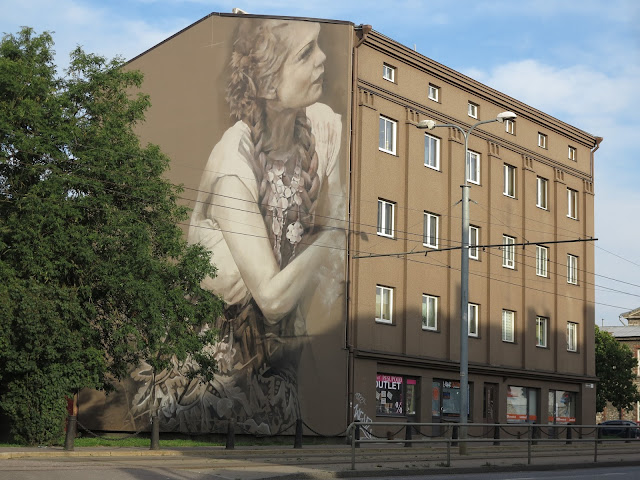 Guido Van Helten is currently in Eastern Europe where he just finished working on a brand new piece somewhere on the streets of Tallinn in Estonia.