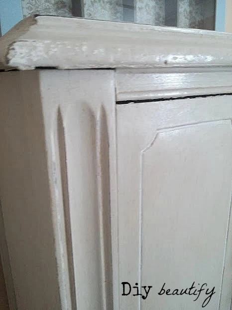 distressing and the addition of dark wax adds depth to an antique hutch
