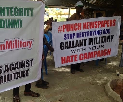 0 Exclusive pics: Pro-military group protest against Punch, Daily Trust, Leadership newspapers