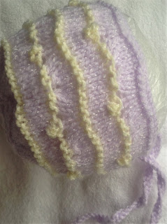 https://www.craftsy.com/knitting/patterns/soft-breeze-baby-bonnet/495366