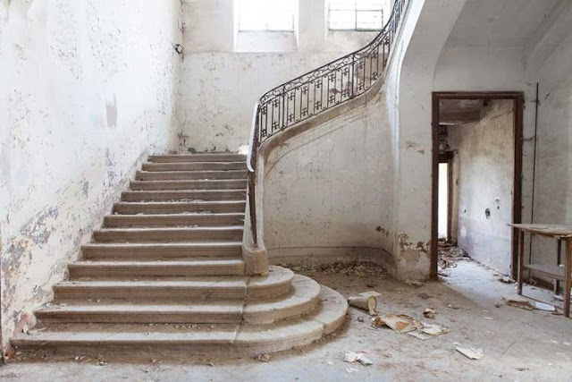 Decaying stone staircase in French Chateau Gudanes