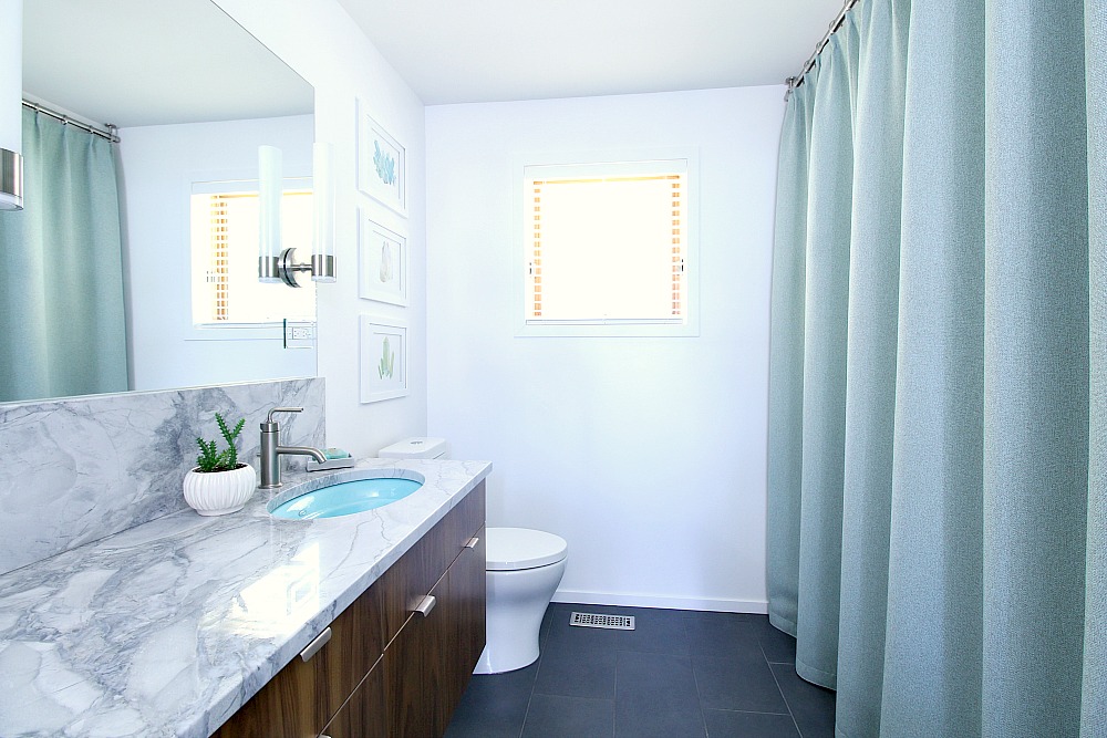 beacy bathroom design Mid-Century Modern Inspired Bathroom Renovation, Before + After - Floating Walnut Vanity, Quartzite Counters, Kohler Purist Fixtures, Aqua Sinks - from www.danslelakehouse.com