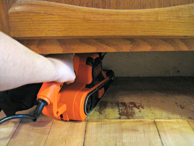 black and decker sander sanding floor under cabinet