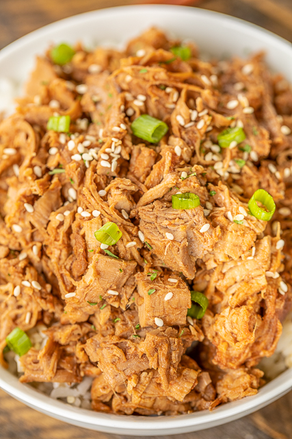 Slow Cooker Huli Huli Pork Tenderloin - DANGEROUSLY good!!! Pork tenderloin slow cooked in brown sugar, soy sauce, ketchup, sherry, ginger, and garlic. We ate this twice in one week. It was seriously delicious!! Serve over rice, potatoes or noodles. Also great on top of a salad or nachos! #slowcooker #pork #dinner Slow Cooker Huli Huli Pork Tenderloin - DANGEROUSLY good!!! Pork tenderloin slow cooked in brown sugar, soy sauce, ketchup, sherry, ginger, and garlic. We ate this twice in one week. It was seriously delicious!! Serve over rice, potatoes or noodles. Also great on top of a salad or nachos! #slowcooker #pork #dinner