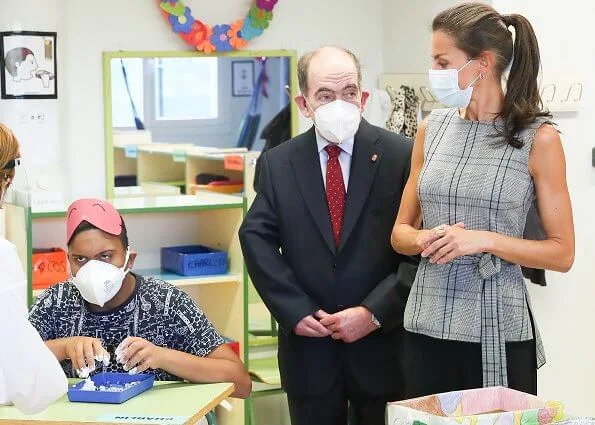 Queen Letizia wore a plaid belted top from Zara and Letizia wore Castaner black Carina ankle tie wedge, and black Hugo Boss cropped wide leg trousers