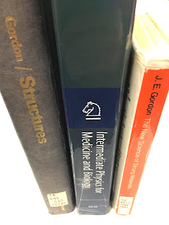 A photo of three books: (left) Structures: Or Why Things Don't Fall Down, (center) Intermediate Physics for Medicine and Biology, and (right) The New Science of Strong Materials: Or Why You Don’t Fall Through the Floor.