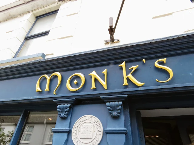 Best Places to Eat in Cork: Monk's Lane Bar and Restaurant Sign in the West Cork town of Timoleague