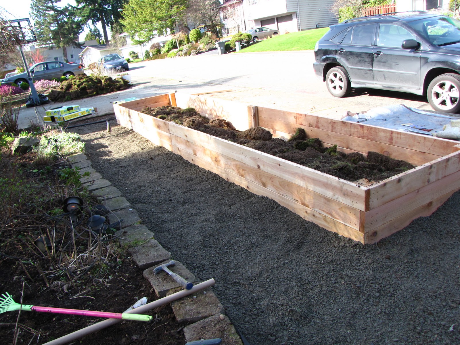 A Gardener in Progress Front garden progress Raised beds and gravel.