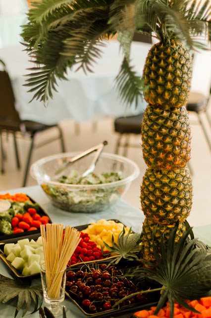 cored pineapples create a palm tree centerpiece