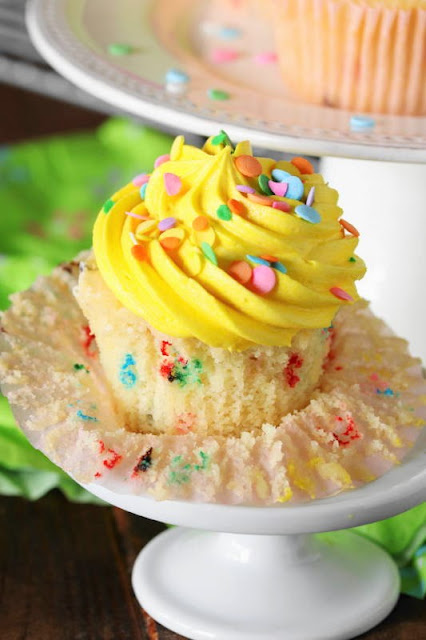 Put a smile on your birthday girl or boy's face with adorably fun and festive Funfetti Happy Birthday Cupcakes.  And these little cupcake beauties are as tasty as they are cute!