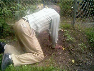 Willie weeding his garden.