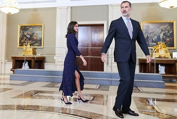 Queen Letizia wore a new asymmetric midi dress by Maje. We saw the same dress on Argentina's First Lady Juliana Awada