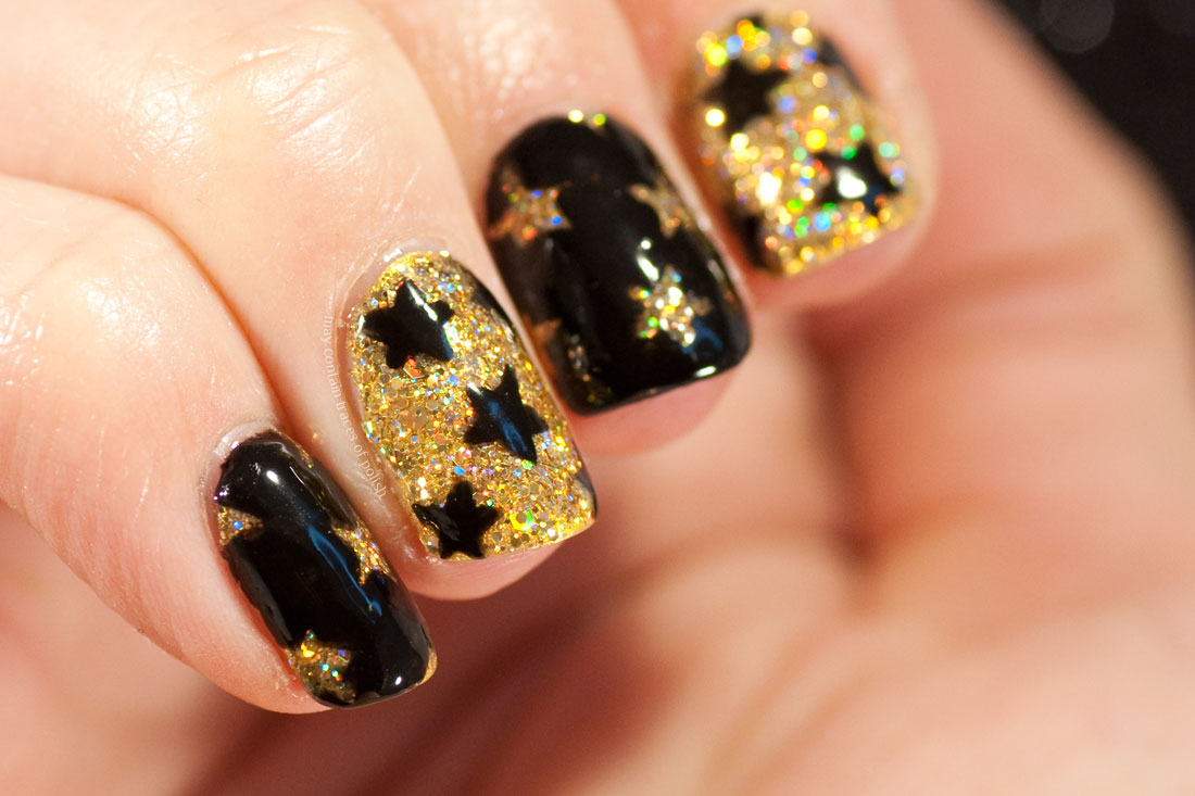 Sparkly Gold New Years Nails with star pattern