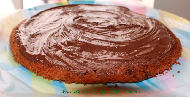 Big Chocolate Chip Nutella Frosted Cookie A huge chocolate chip cookie baked in a pizza round pan and frosted with Nutella for the topping the perfect birthday big cookie