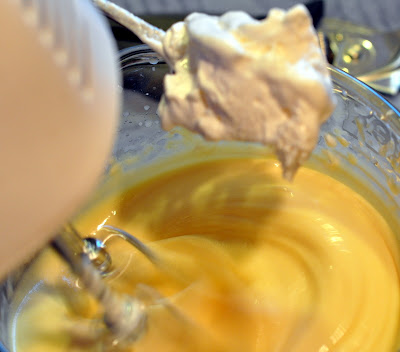 mixing pudding with the cream cheese and whipped topping