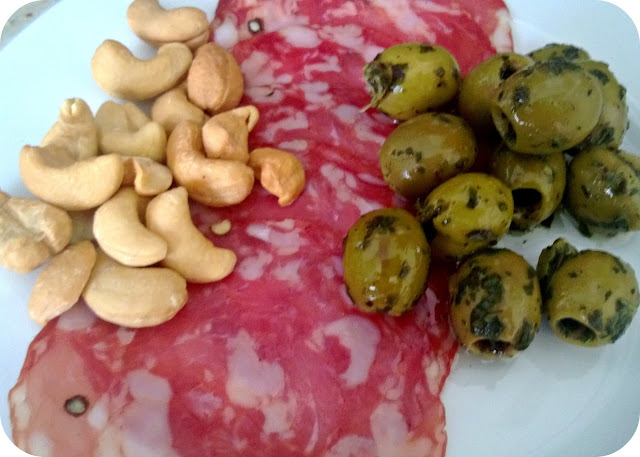 Antipasto - salami, olives and cashew nuts