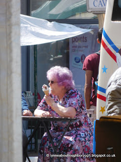 Lady with pink hair eating icecream Lady with pink hair eating icecream
