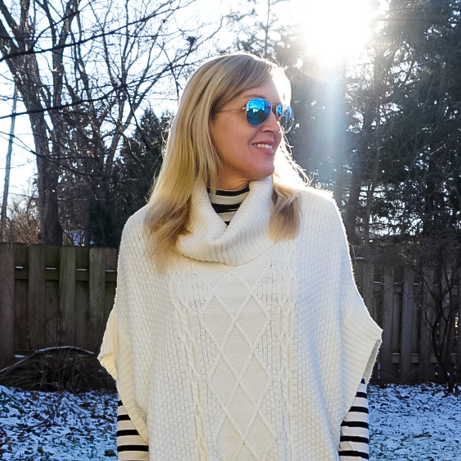 striped turtleneck and poncho sweater