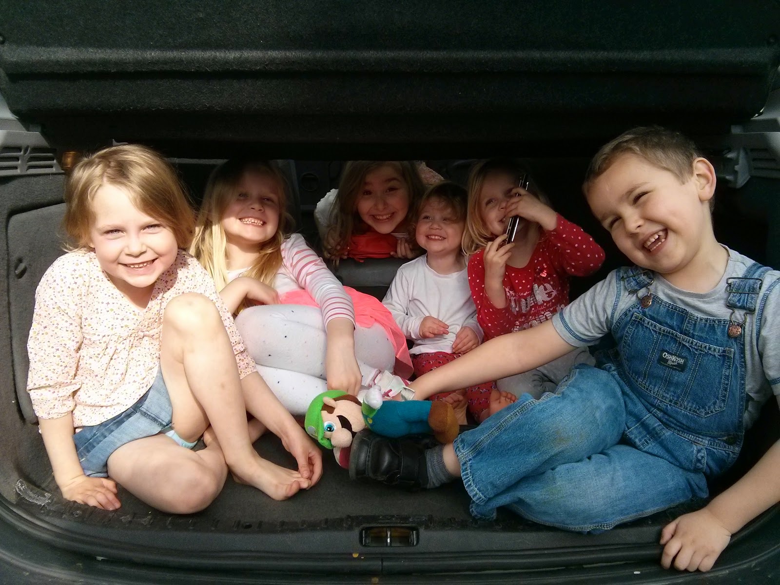 Cousins packed in the boot of the car