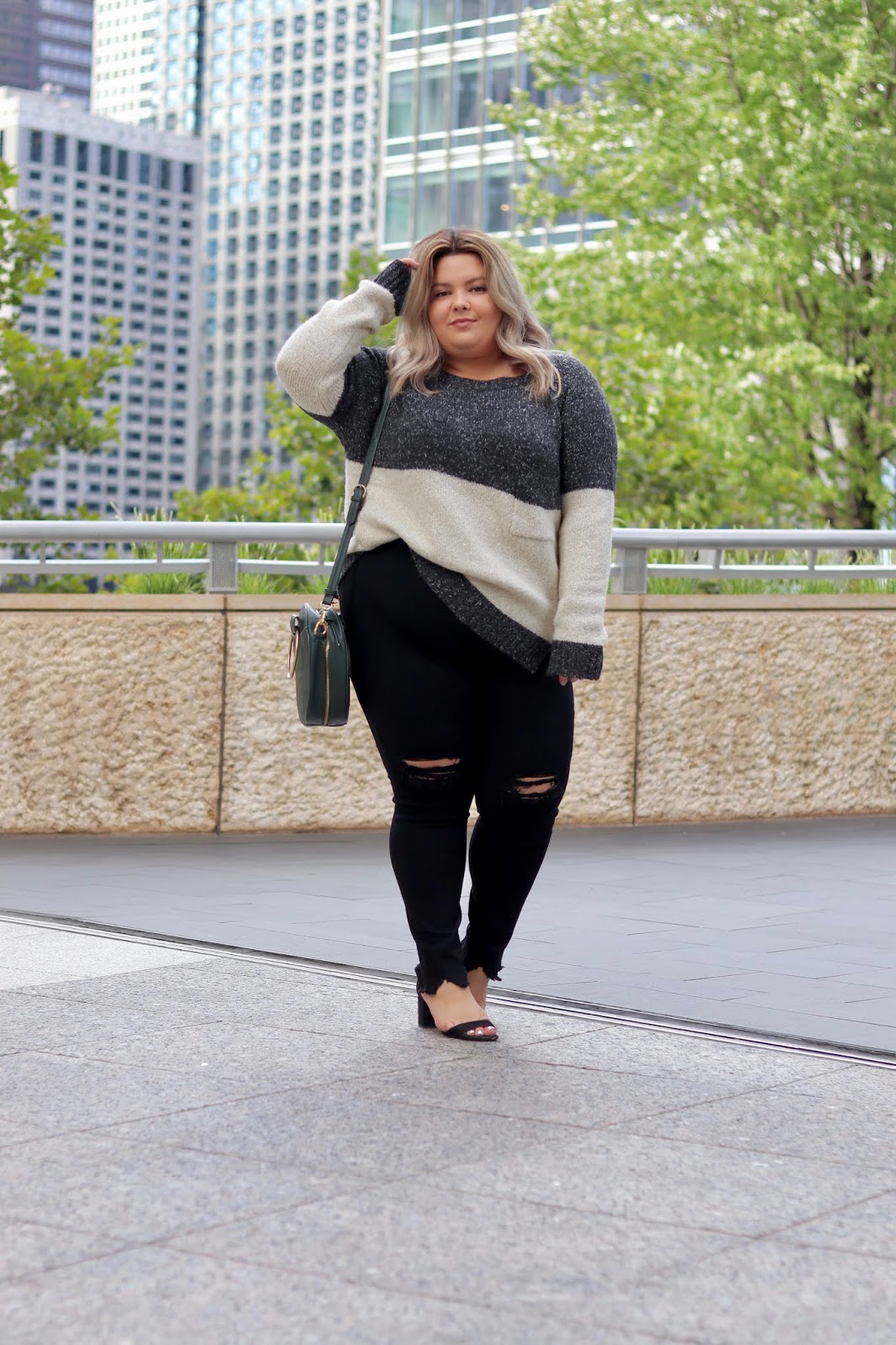 Chicago Plus Size Petite Fashion Blogger Natalie in the City wears plus size oversized sweaters.